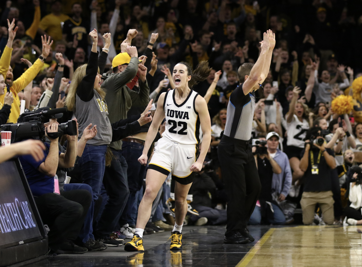IOWA+CITY%2C+IOWA-+FEBRUARY+15%3A++Guard+Caitlin+Clark+%2322+of+the+Iowa+Hawkeyes+celebrates+after+breaking+the+NCAA+womens+all-time+scoring+record+during+the+first+half+against+the+Michigan+Wolverines++at+Carver-Hawkeye+Arena+on+February+15%2C+2024+in+Iowa+City%2C+Iowa.++%28TNS+Photo+by+Matthew+Holst%2FGetty+Images%29